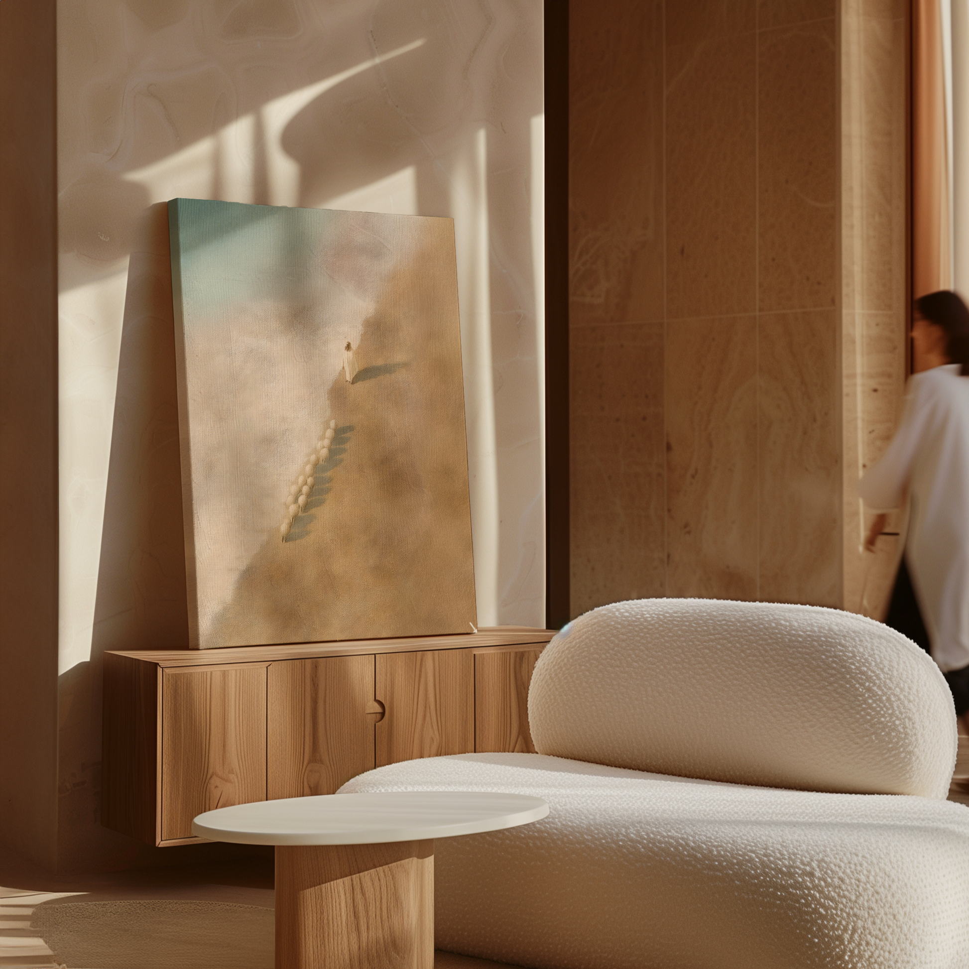 Modern interior with a textured beige chair, wooden cabinet, and abstract painting.